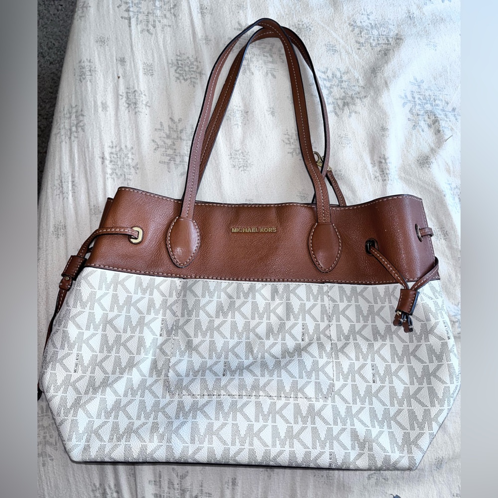 Authentic MK with makeup stains and a stain on outside.